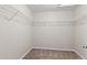 Spacious walk-in closet with carpeted floors and wire shelving for optimal storage and organization at 21210 E Radcliff Pl, Aurora, CO 80015