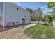 Spacious backyard with stone patio, green lawn, rock features, and a well maintained fence at 18807 E 51St Pl, Denver, CO 80249