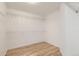 Walk-in closet with wood floors and white walls, wire shelves and racks for ample storage at 18807 E 51St Pl, Denver, CO 80249