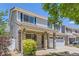 Charming two-story home featuring stone accents, blue shutters, and a well-manicured front yard at 18807 E 51St Pl, Denver, CO 80249