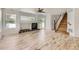 Inviting living room with wood floors, fireplace, and sliding glass doors providing natural light at 18807 E 51St Pl, Denver, CO 80249