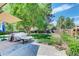 Well-maintained backyard, featuring a patio area, lush greenery, and mature trees, perfect for outdoor relaxation and entertainment at 6971 S Valentia St, Centennial, CO 80112