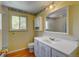 Bathroom offering a single sink vanity and a window that brings in natural light at 6971 S Valentia St, Centennial, CO 80112