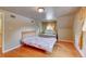 Bedroom with hardwood floors, natural light, and a unique layout at 6971 S Valentia St, Centennial, CO 80112