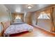 Bedroom featuring hardwood floors and natural light at 6971 S Valentia St, Centennial, CO 80112