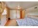 Spacious bedroom with hardwood floors and double closets for ample storage at 6971 S Valentia St, Centennial, CO 80112