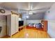 Comfortable bedroom with hardwood floors, a ceiling fan, and a well-lit ambiance, ideal for rest and rejuvenation at 6971 S Valentia St, Centennial, CO 80112