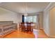 Bright dining area with hardwood floors, a chandelier, and crib in the corner at 6971 S Valentia St, Centennial, CO 80112