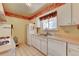 Functional kitchen with a gas range, dishwasher, and tiled flooring at 6971 S Valentia St, Centennial, CO 80112