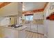 Open kitchen layout with a gas cooktop island and plenty of cabinet space at 6971 S Valentia St, Centennial, CO 80112