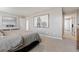 This serene bedroom features a stylish horse painting, a neutral color scheme, and plush carpeting at 4853 Cattle Cross Ln, Castle Rock, CO 80104
