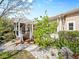 Beautifully landscaped backyard with a pergola, deck, and decorative rock features at 9734 Tall Grass Cir, Lone Tree, CO 80124