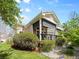 Inviting backyard with a covered porch, stone pathway, and lush landscaping at 9734 Tall Grass Cir, Lone Tree, CO 80124