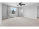 Expansive bedroom with plush carpeting, a large window, and neutral walls, creating a serene and comfortable space at 9734 Tall Grass Cir, Lone Tree, CO 80124