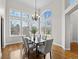 Dining room features a chandelier and many windows, offering natural light at 9734 Tall Grass Cir, Lone Tree, CO 80124