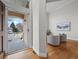 Inviting foyer leads to a bright living space with hardwood floors and stylish decor, creating a warm welcome at 9734 Tall Grass Cir, Lone Tree, CO 80124