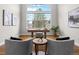 Home office with a large window, desk, and comfortable seating area at 9734 Tall Grass Cir, Lone Tree, CO 80124