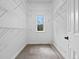 Bright walk-in closet with adjustable shelving and a window for natural light and ventilation at 9734 Tall Grass Cir, Lone Tree, CO 80124