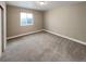 Comfortable bedroom with natural light, plush carpeting, and neutral walls at 1220 W 170Th Ave, Broomfield, CO 80023
