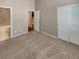 Bedroom features neutral walls and carpet with en suite bath at 1220 W 170Th Ave, Broomfield, CO 80023