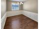 Traditional dining room featuring wainscoting, wood floors, and an elegant chandelier at 1220 W 170Th Ave, Broomfield, CO 80023