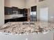 Modern kitchen featuring granite countertops, stainless steel appliances, and ample cabinet space at 1220 W 170Th Ave, Broomfield, CO 80023
