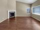 Bright living room with a fireplace and hardwood flooring, ready for your personal touch at 1220 W 170Th Ave, Broomfield, CO 80023