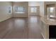 Open-concept living room with hardwood floors, large windows, and great natural light at 1220 W 170Th Ave, Broomfield, CO 80023