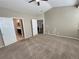 Comfortable main bedroom with neutral tones, carpet, and a ceiling fan at 1220 W 170Th Ave, Broomfield, CO 80023
