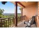 Picturesque balcony view featuring comfortable seating and breathtaking mountain scenery, perfect for relaxation and enjoyment at 33095 Bergen Mountain Rd, Evergreen, CO 80439