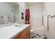 Clean bathroom featuring a vanity with modern fixtures, toilet, and shower at 33095 Bergen Mountain Rd, Evergreen, CO 80439