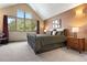Spacious bedroom featuring a large window with a view, neutral walls and a carpeted floor at 33095 Bergen Mountain Rd, Evergreen, CO 80439