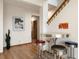 Dining area featuring a round table with stools and a wood floor at 33095 Bergen Mountain Rd, Evergreen, CO 80439