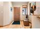 Warm entryway with hardwood floors, decorative accents, and a charming hat rack creating a welcoming atmosphere at 33095 Bergen Mountain Rd, Evergreen, CO 80439
