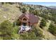Inviting home with an expansive deck, perfect for outdoor living and relaxation, surrounded by natural beauty and trees at 33095 Bergen Mountain Rd, Evergreen, CO 80439