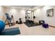 Well-equipped home gym with weight rack, exercise ball, inversion table and padded flooring at 33095 Bergen Mountain Rd, Evergreen, CO 80439