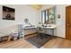 Comfortable home office with a large window and custom built desk at 33095 Bergen Mountain Rd, Evergreen, CO 80439
