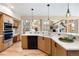 Bright kitchen with wooden cabinets, stainless steel appliances, and an open layout at 33095 Bergen Mountain Rd, Evergreen, CO 80439