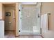 Newly renovated stand up shower with patterned tile and glass door at 33095 Bergen Mountain Rd, Evergreen, CO 80439