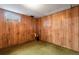 Basement area with carpet, wood paneling, and a small window at 147 Wallace St, Northglenn, CO 80234