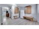 Finished basement area features laminated wood flooring, cabinets and work benches at 147 Wallace St, Northglenn, CO 80234