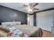 Comfortable bedroom with a ceiling fan, closet, and hardwood floors, providing a cozy atmosphere at 147 Wallace St, Northglenn, CO 80234