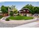 Charming home featuring a well-manicured lawn, stone accents, mature trees, and a brick and wood exterior at 147 Wallace St, Northglenn, CO 80234