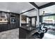 Updated kitchen featuring sleek countertops, gray cabinetry, and stainless steel appliances with a breakfast bar at 147 Wallace St, Northglenn, CO 80234