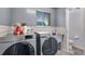 Laundry room with newer washer/dryer appliances and tile flooring at 147 Wallace St, Northglenn, CO 80234