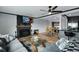 Spacious living room featuring hardwood floors, fireplace, and adjacent dining area at 147 Wallace St, Northglenn, CO 80234