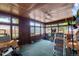Enclosed sunroom with door to yard, windows, and carpet at 147 Wallace St, Northglenn, CO 80234
