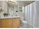 Bright bathroom with a vanity, a window, and a shower-tub combination for convenience and comfort at 20000 Mitchell Pl # 9, Denver, CO 80249