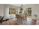 Cozy dining area with a view of the backyard, ample natural light, and a table for six at 20000 Mitchell Pl # 9, Denver, CO 80249