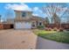 Charming two-story home featuring a brick driveway, attached garage and well-manicured lawn with privacy fence at 20000 Mitchell Pl # 9, Denver, CO 80249